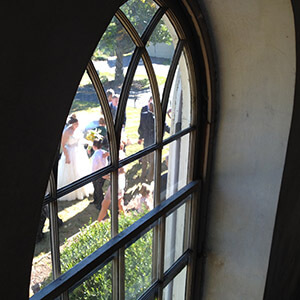 Church window view showing wedding Image